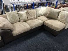 A contemporary two-tone corner suite with footstool