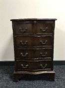 A mahogany serpentine fronted four drawer chest