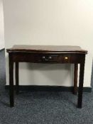 A Georgian mahogany turn over top table