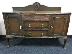 An oak sideboard on pad feet