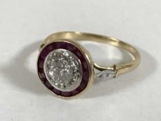 An Art Deco 18ct gold diamond and ruby set cluster ring