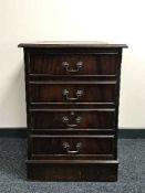 A mahogany leather topped filing chest