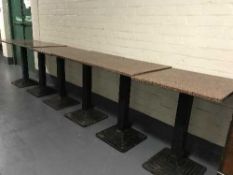 A set of six square marble topped metal based cafe tables