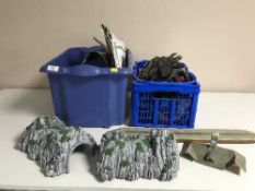 Two boxes of model train track,