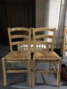 A set of sixteen pine rush seated cafe chairs