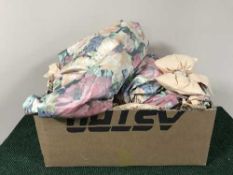 Two boxes of floral patterned curtains and tie backs