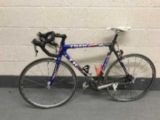 A Trek US Postal team colours road bike, OCLV carbon frame, blue, grey, white and red, medium frame,