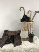 Wicker stick stand, walking sticks and umbrellas,