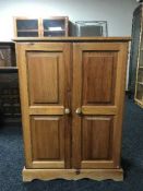 A pine double door cupboard