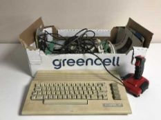 A box of Commodore 64 with games and accessories