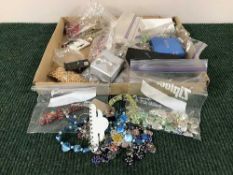 A box of assorted costume jewellery and mobile phone charms