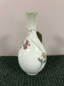 A Royal Worcester hand painted ivory fluted vase,