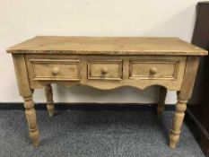 A reclaimed pine three drawer hall table
