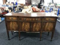 A Regency style serpentine fronted four door sideboard