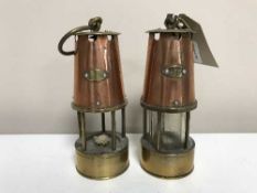 Two miniature copper and brass miner's lamps