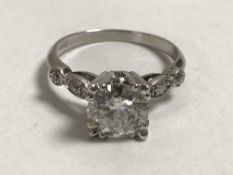 A large antique solitaire diamond ring in platinum, the central stone approximately 1.7 ct.