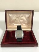 A Gents vintage stainless steel Longines wristwatch with square case and silvered dial,