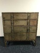 An Edwardian oak four drawer chest