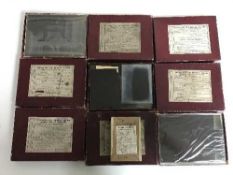 A tray of photographic glass plates including police and country house