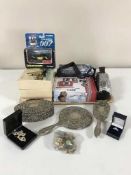 A tray of digital cameras, jewellery box, plated dressing table set,