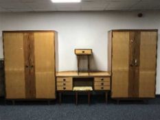 A five piece mid twentieth century teak Butilux bedroom suite comprising of two double door