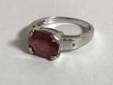 An 18ct white gold ring set with a large ruby