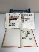 Three albums of stamps of the world including British 1966 World Cup stamps