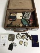 A mahogany box containing assorted collectables to include coin case, wristwatches,