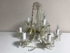 A decorative early twentieth century brass twelve branch chandelier