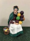 A Royal Doulton figure - The Old Balloon Seller HN 1315