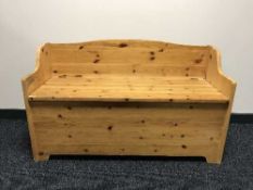 A pine storage hall seat