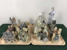 Two trays of two Lladro figures and nine David Winter cottages