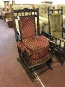 A mahogany American style rocking chair upholstered in red fabric together with matching footstool