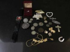 A collection of coins and silver jewellery - earring, brooches,