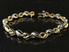 An 18ct gold sapphire and diamond bracelet, diamond weight estimated at 2.00 carats, 15.