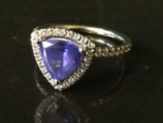 A 14ct white gold diamond and tanzanite ring,