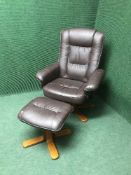 A brown leather swivel relaxer chair with stool