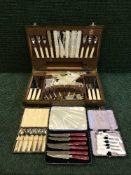 An oak canteen of cutlery together with a further eight boxes of cutlery