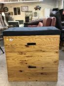 A pine storage chest in the form of a gymnast's vault