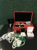 A basket containing jewellery box, dress rings, beads,