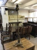 An antique brass telescopic standard oil lamp