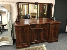 A Victorian inverted breakfront mahogany mirror back sideboard