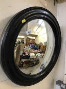 A circular convex porthole mirror