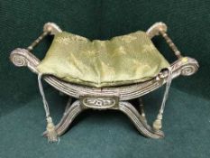 An antique gilt wood scroll end dressing table stool