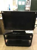 A Panasonic Viera 32 Lcd tv on stand with remote