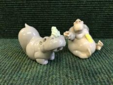 Two Nao figures - Ape holding a flower and Hippopotamus with frog
