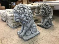 A pair of garden lion figures