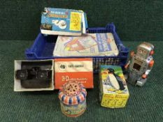 A box of mid twentieth century tin plate walking penguin and robot, play-value microscope,