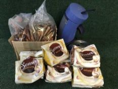 A Philips Senseo coffee maker together with a large quantity of coffee sachets