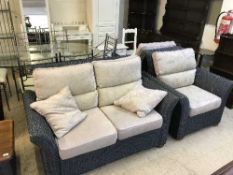 A four piece rattan conservatory suite